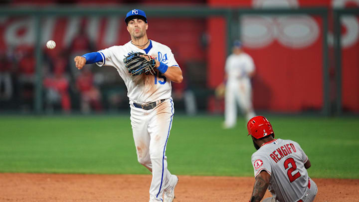 Jul 25, 2022; Kansas City, Missouri, USA; Kansas City Royals second baseman Whit Merrifield (15) throws to first base after forcing out Los Angeles Angels second baseman Luis Rengifo (2) at second base during the ninth inning at Kauffman Stadium. Mandatory Credit: Jay Biggerstaff-Imagn Images