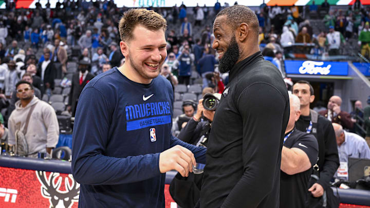 Dec 25, 2022; Dallas, Texas, USA; Dallas Mavericks guard Luka Doncic (left) talks with Los Angeles Lakers forward LeBron James (right) after the game between the Mavericks and the Lakers at American Airlines Center. Mandatory Credit: Jerome Miron-Imagn Images