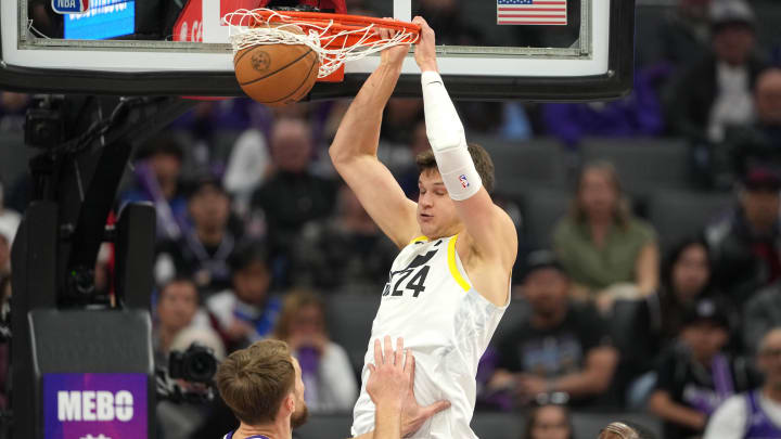 Mar 31, 2024; Sacramento, California, USA; Utah Jazz center Walker Kessler (24) dunks against Sacramento Kings forward Domantas Sabonis (bottom left) during the second quarter at Golden 1 Center. Mandatory Credit: Darren Yamashita-USA TODAY Sports Mar 31, 2024; Sacramento, California, USA; Utah Jazz center Walker Kessler (24) dunks against Sacramento Kings forward Domantas Sabonis (bottom left) during the second quarter at Golden 1 Center. Mandatory Credit: Darren Yamashita-USA TODAY Sports
