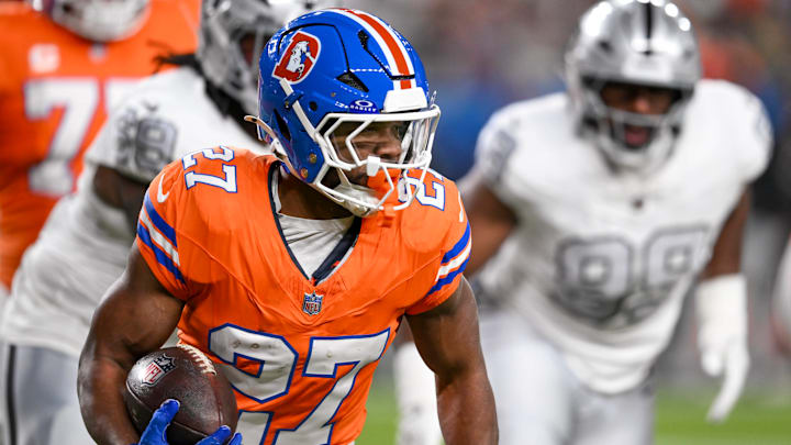 DENVER, CO - NOVEMBER 06: J.K. Dobbins 27 of the Denver Broncos, runs the ball during a game between the Las Vegas Raiders and the Denver Broncos at Empower Field at Mile High in Denver, CO on November 06, 2025. 