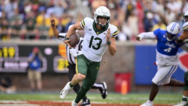 Sep 6, 2025; Dallas, Texas, USA; Baylor Bears quarterback Sawyer Robertson (13) runs with the ball during the game between the SMU Mustangs and the Baylor Bears at Gerald J. Ford Stadium. Mandatory Credit: Jerome Miron-Imagn Images