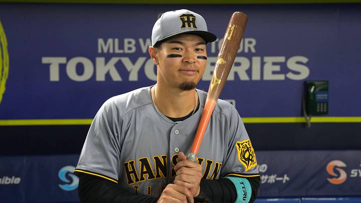 Mar 15, 2025; Bunkyo, Tokyo, Japan; Hanshin Tigers right fielder Teruaki Sato (8) poses for a photo after defeating the Chicago Cubs at Tokyo Dome. Mandatory Credit: Darren Yamashita-Imagn Images Mar 15, 2025; Bunkyo, Tokyo, Japan; Hanshin Tigers right fielder Teruaki Sato (8) poses for a photo after defeating the Chicago Cubs at Tokyo Dome. Mandatory Credit: Darren Yamashita-Imagn Images