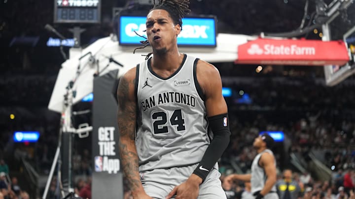 Apr 8, 2026; San Antonio, Texas, USA; San Antonio Spurs guard Devin Vassell (24) reacts after getting fouled while attempting to dunk during the first half against the Portland Trail Blazers at Frost Bank Center. Mandatory Credit: Scott Wachter-Imagn Images