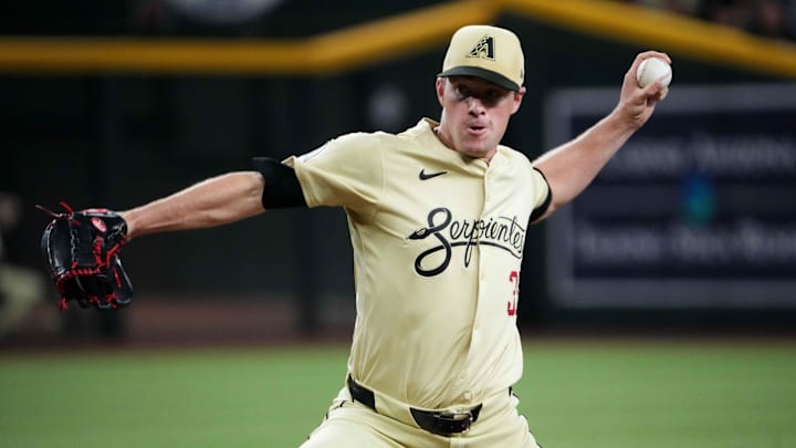 Aug 13, 2024; Phoenix, Arizona, USA; Arizona Diamondbacks pitcher Joe Mantiply (35) pitches against the Colorado Rockies during the ninth inning at Chase Field. Mandatory Credit: Joe Camporeale-Imagn Images Aug 13, 2024; Phoenix, Arizona, USA; Arizona Diamondbacks pitcher Joe Mantiply (35) pitches against the Colorado Rockies during the ninth inning at Chase Field. Mandatory Credit: Joe Camporeale-Imagn Images