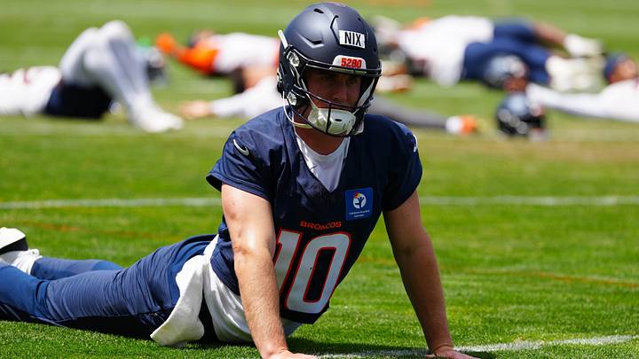 Denver Broncos quarterback Bo Nix (10) warms up before practice at Broncos Park. Mandatory Credit: Ron Chenoy-Imagn Images