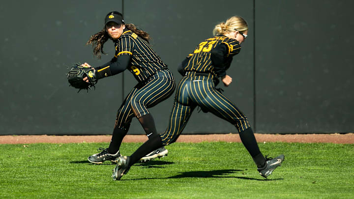 Iowa's Tatianna Roman, left, fields a ball during a NCAA Big Ten Conference softball game against Nebraska, Tuesday, March 28, 2023, at Bob Pearl Field in Iowa City, Iowa.

230328 Nebraska Iowa Sb 058 Jpg