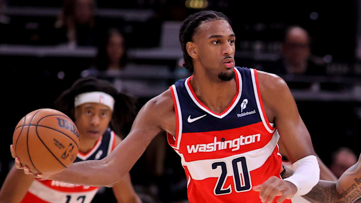 Nov 12, 2025; Houston, Texas, USA; Washington Wizards center Alex Sarr (20) handles the ball against Houston Rockets forward Jabari Smith Jr. (10) during the game at Toyota Center. Mandatory Credit: Erik Williams-Imagn Images