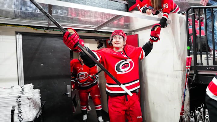 Jan 17, 2025; Raleigh, North Carolina, USA; Carolina Hurricanes center Martin Necas (88) goes past the fans for the warmups before the game against the Vegas Golden Knights at Lenovo Center. Mandatory Credit: James Guillory-Imagn Images