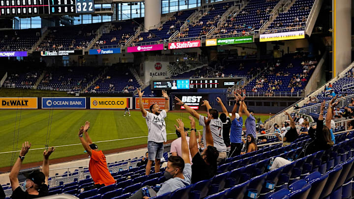 Apr 1, 2021; Miami, Florida, USA; Miami Marlins fans attempt to start the wave in the 8th inning between the Miami Marlins and the Tampa Bay Rays at loanDepot park. Apr 1, 2021; Miami, Florida, USA; Miami Marlins fans attempt to start the wave in the 8th inning between the Miami Marlins and the Tampa Bay Rays at loanDepot park.