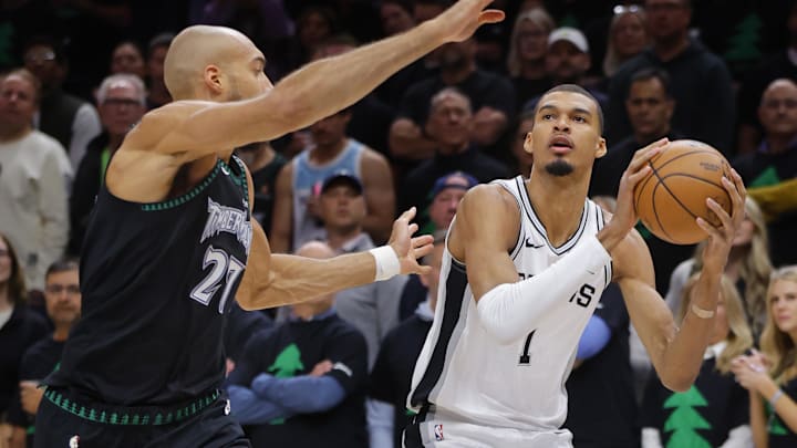 May 10, 2026; Minneapolis, Minnesota, USA; San Antonio Spurs center Victor Wembanyama (1) shoots against Minnesota Timberwolves center Rudy Gobert (27) in the first quarter of game four of the second round of the 2026 NBA Playoffs at Target Center.