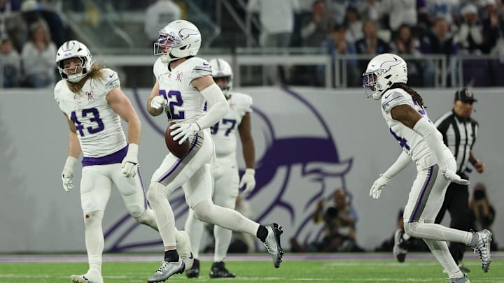 Dec 25, 2025; Minneapolis, Minnesota, USA; Minnesota Vikings safety Harrison Smith (22) celebrates after catching an interception against the Detroit Lions in the third quarter at U.S. Bank Stadium.