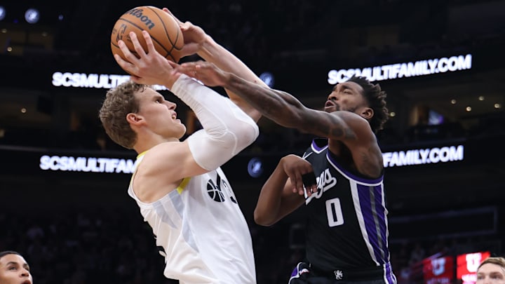 Oct 15, 2024; Salt Lake City, Utah, USA; Utah Jazz forward Lauri Markkanen (23) goes to the basket against Sacramento Kings guard Malik Monk (0) during the second quarter at Delta Center. Mandatory Credit: Rob Gray-Imagn Images