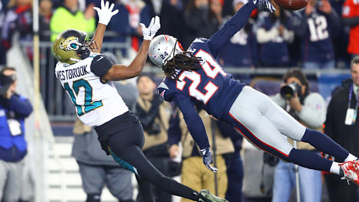 Jan 21, 2018; Foxborough, MA, USA; New England Patriots cornerback Stephon Gilmore (24) breaks up a pass intended for Jacksonville Jaguars wide receiver Dede Westbrook (12) in the fourth quarter of the AFC Championship Game at Gillette Stadium. Mandatory Credit: Mark J. Rebilas-Imagn Images