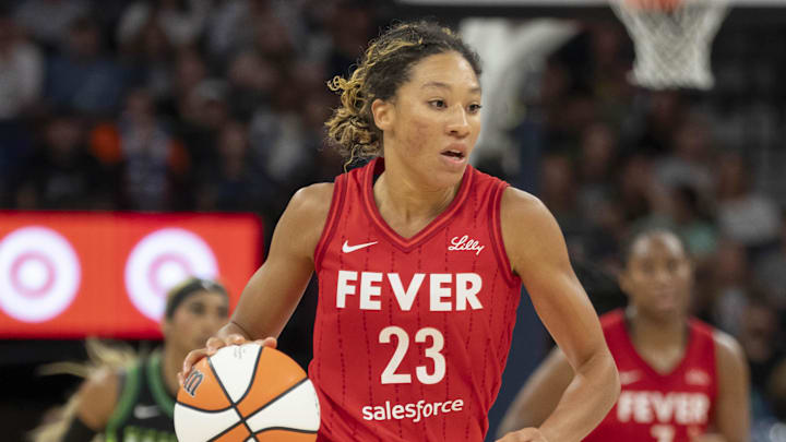 Aug 24, 2025; Minneapolis, Minnesota, USA; Indiana Fever guard Aerial Powers (23) dribbles the ball against the Minnesota Lynx in the second half at Target Center. Mandatory Credit: Jesse Johnson-Imagn Images