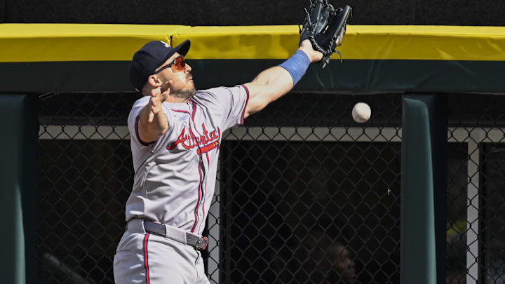Former Atlanta Braves outfielder Adam Duvall (14) tries to make the play on the double hit by Chicago White Sox first baseman Andrew Vaughn (not pictured) during the sixth inning at Guaranteed Rate Field.