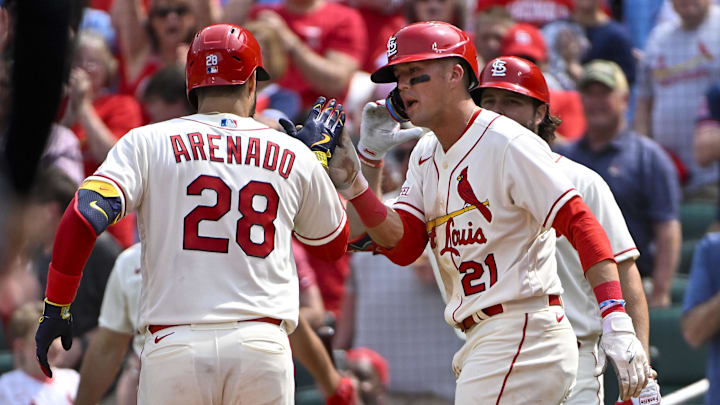 May 6, 2023; St. Louis, Missouri, USA;  St. Louis Cardinals third baseman Nolan Arenado (28) is congratulated by right fielder Lars Nootbaar (21) after hitting a two run home run against the Detroit Tigers during the fifth inning at Busch Stadium. Mandatory Credit: Jeff Curry-Imagn Images