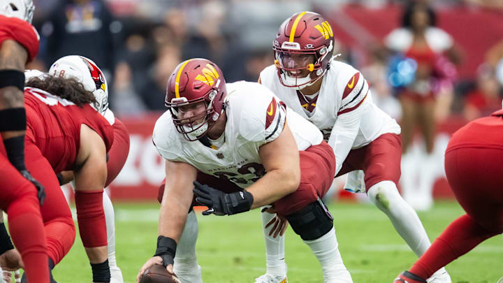 Sep 29, 2024; Glendale, Arizona, USA; Washington Commanders center Tyler Biadasz (63) prepares to snap the ball to quarterback Jayden Daniels (5) against the Arizona Cardinals at State Farm Stadium. Mandatory Credit: Mark J. Rebilas-Imagn Images Sep 29, 2024; Glendale, Arizona, USA; Washington Commanders center Tyler Biadasz (63) prepares to snap the ball to quarterback Jayden Daniels (5) against the Arizona Cardinals at State Farm Stadium. Mandatory Credit: Mark J. Rebilas-Imagn Images