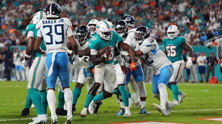 Miami Dolphins quarterback Tyler Huntley (18) rushes for a touchdown  during the second half against the Tennessee Titans at Hard Rock Stadium.