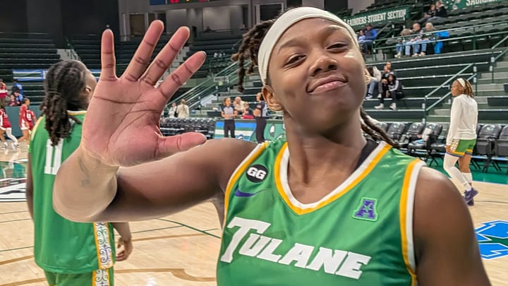 Tulane guard CC Mays in the Wave’s Mardi Gras Unis