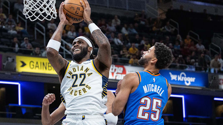 Oct 11, 2025; Indianapolis, Indiana, USA; Indiana Pacers forward Isaiah Jackson (22) shoots the ball while Oklahoma City Thunder guard Ajay Mitchell (25) defends in the first half at Gainbridge Fieldhouse. Mandatory Credit: Trevor Ruszkowski-Imagn Images