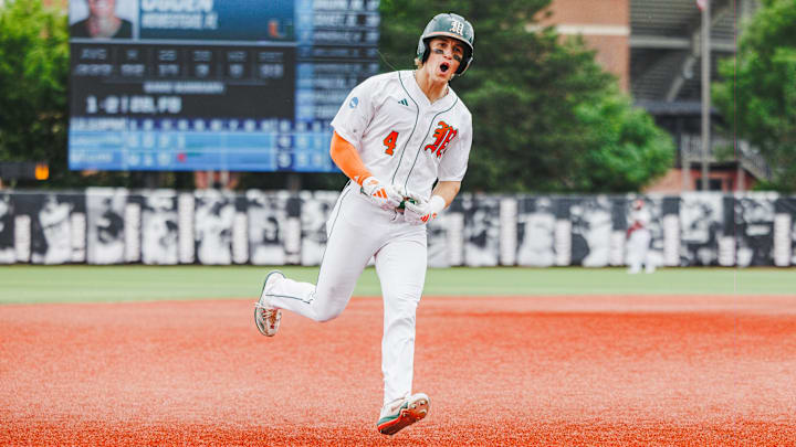 Miami Hurricanes Shortstop Jake Ogden (4) after hitting a homerun.