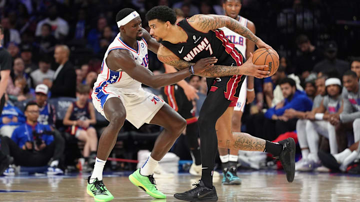 Mar 29, 2025; Philadelphia, Pennsylvania, USA; Miami Heat center Kel'el Ware (7) controls the ball against Philadelphia 76ers center Adem Bona (30) in the third quarter at Wells Fargo Center. Mandatory Credit: Kyle Ross-Imagn Images