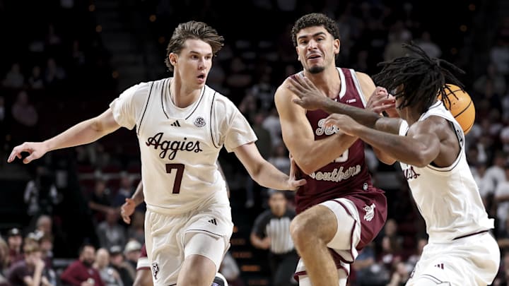 Nov 6, 2025; College Station, Texas, USA;  Texas Southern Tigers guard Ahmed Nedal Abdelrahman (15) drives to the basket as Texas A&M Aggies forward Zach Clemence (7) and guard Josh Holloway (1) defend during the second half at Reed Arena. Mandatory Credit: Maria Lysaker-Imagn Images 