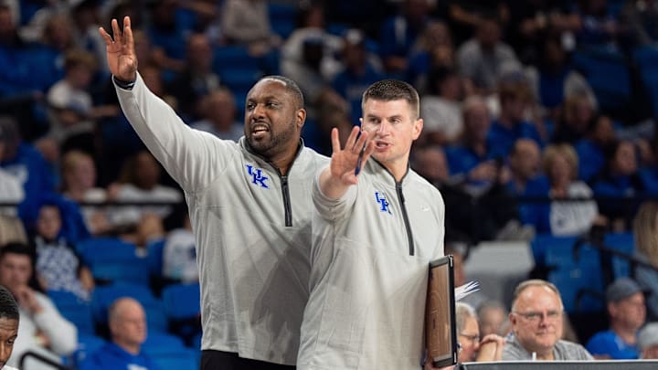 Kentucky Wildcats Associate Head Coach Alvin Brooks III and assistant coach Cody Fueger call out to the team during the Kentucky Blue-White preseason event on Friday, Oct. 18, 2024 at the Memorial Coliseum.
