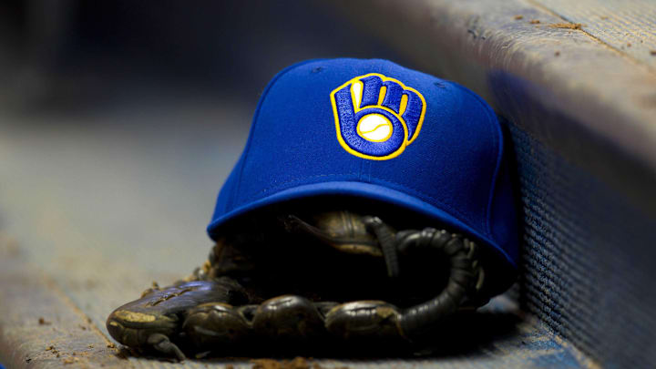 June 10, 2011; Milwaukee, WI, USA; A Milwaukee Brewers hat and glove during the game against the St. Louis Cardinals at Miller Park. The Brewers defeated the Cardinals 8-0. Mandatory Credit: Jeff Hanisch-Imagn Images June 10, 2011; Milwaukee, WI, USA; A Milwaukee Brewers hat and glove during the game against the St. Louis Cardinals at Miller Park. The Brewers defeated the Cardinals 8-0. Mandatory Credit: Jeff Hanisch-Imagn Images