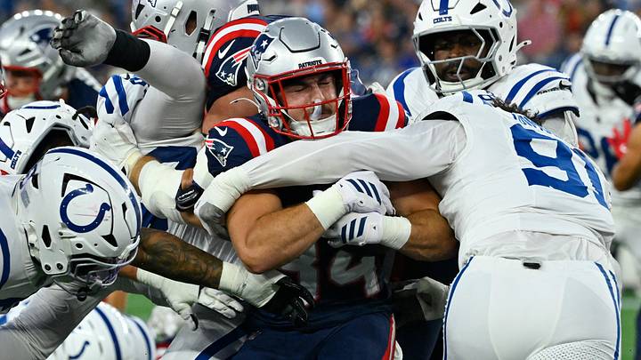 Aug 13, 2026; Foxborough, Massachusetts, USA; New England Patriots running back Lan Larison (34) is tackled by Indianapolis Colts defensive end Jaylahn Tuimoloau (91) during the first half at Gillette Stadium. Mandatory Credit: Eric Canha-Imagn Images Aug 13, 2026; Foxborough, Massachusetts, USA; New England Patriots running back Lan Larison (34) is tackled by Indianapolis Colts defensive end Jaylahn Tuimoloau (91) during the first half at Gillette Stadium. Mandatory Credit: Eric Canha-Imagn Images