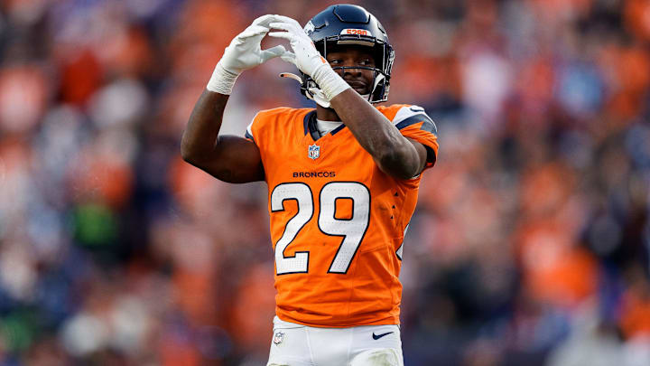 Dec 15, 2024; Denver, Colorado, USA; Denver Broncos cornerback Ja'Quan McMillian (29) gestures in the third quarter against the Indianapolis Colts at Empower Field at Mile High. 