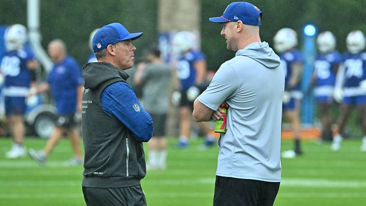 Buffalo Bills head coach Joe Brady (right) speaks with general manager Brandon Beane during training camp at St. John Fisher University. Mandatory Credit: Mark Konezny-Imagn Images