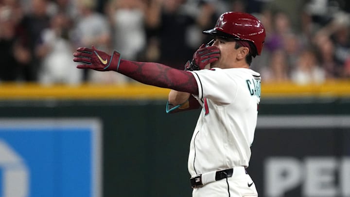 Mar 31, 2026; Phoenix, Arizona, USA; Arizona Diamondbacks right fielder Corbin Carroll (7) reacts after hitting a two run double against the Detroit Tigers in the eighth inning at Chase Field. Mandatory Credit: Rick Scuteri-Imagn Images