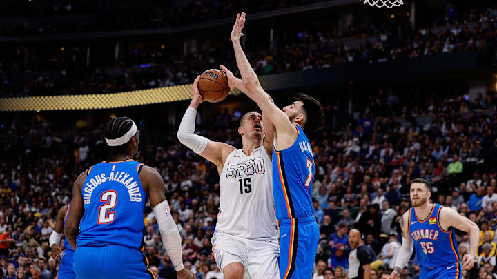 May 15, 2025; Denver, Colorado, USA; Denver Nuggets center Nikola Jokic (15) drives to the net against Oklahoma City Thunder forward Chet Holmgren (7) as guard Shai Gilgeous-Alexander (2) defends in the third quarter during game six of the second round for the 2025 NBA Playoffs at Ball Arena. Mandatory Credit: Isaiah J. Downing-Imagn Images May 15, 2025; Denver, Colorado, USA; Denver Nuggets center Nikola Jokic (15) drives to the net against Oklahoma City Thunder forward Chet Holmgren (7) as guard Shai Gilgeous-Alexander (2) defends in the third quarter during game six of the second round for the 2025 NBA Playoffs at Ball Arena. Mandatory Credit: Isaiah J. Downing-Imagn Images