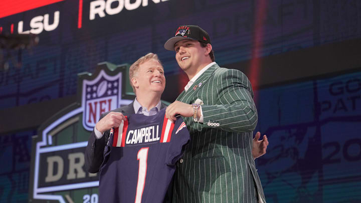 NFL commissioner Roger Goodell poses with Offensive Tackle Will Campbell of LSU after he is selected by the New England Patriots as the number four pick in the first round of the 2025 NFL Draft at Lambeau Field.