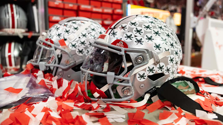 Jan 20, 2025; Atlanta, GA, USA; Detailed view of confetti with an Ohio State Buckeyes helmet after winning the CFP National Championship college football game at Mercedes-Benz Stadium. Mandatory Credit: Mark J. Rebilas-Imagn Images