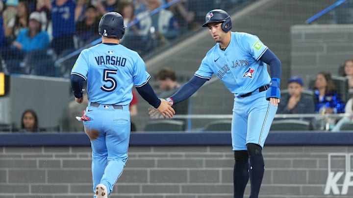May 31, 2025; Toronto, Ontario, CAN; Toronto Blue Jays designated hitter George Springer (4) and center fielder Daulton Varsho (5) celebrate scoring runs against the Athletics during the first inning at Rogers Centre. Mandatory Credit: Nick Turchiaro-Imagn Images May 31, 2025; Toronto, Ontario, CAN; Toronto Blue Jays designated hitter George Springer (4) and center fielder Daulton Varsho (5) celebrate scoring runs against the Athletics during the first inning at Rogers Centre. Mandatory Credit: Nick Turchiaro-Imagn Images
