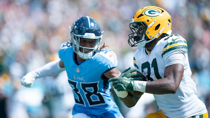 Green Bay Packers running back Emanuel Wilson (31) outruns Tennessee Titans cornerback L'Jarius Sneed (38) to score a 30 yard touchdown in the third quarter of their game at Nissan Stadium in Nashville, Tenn., Sunday, Sept. 22, 2024.