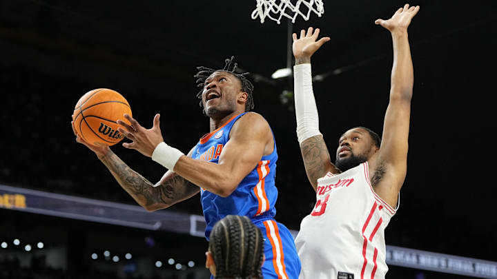 Apr 7, 2025; San Antonio, TX, USA; Florida Gators guard Alijah Martin (15) shoots the ball against Houston Cougars forward J'Wan Roberts (13) during the second half of the national championship game of the Final Four of the 2025 NCAA Tournament at the Alamodome. Mandatory Credit: Bob Donnan-Imagn Images Apr 7, 2025; San Antonio, TX, USA; Florida Gators guard Alijah Martin (15) shoots the ball against Houston Cougars forward J'Wan Roberts (13) during the second half of the national championship game of the Final Four of the 2025 NCAA Tournament at the Alamodome. Mandatory Credit: Bob Donnan-Imagn Images