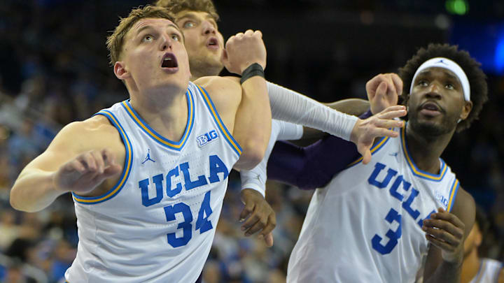 Jan 24, 2026; Los Angeles, California, USA;  UCLA Bruins forward Tyler Bilodeau (34) and guard Eric Dailey Jr. (3) box out Northwestern Wildcats forward Nick Martinelli (2) in the second half at Pauley Pavilion presented by Wescom Financial. Mandatory Credit: Jayne Kamin-Oncea-Imagn Images