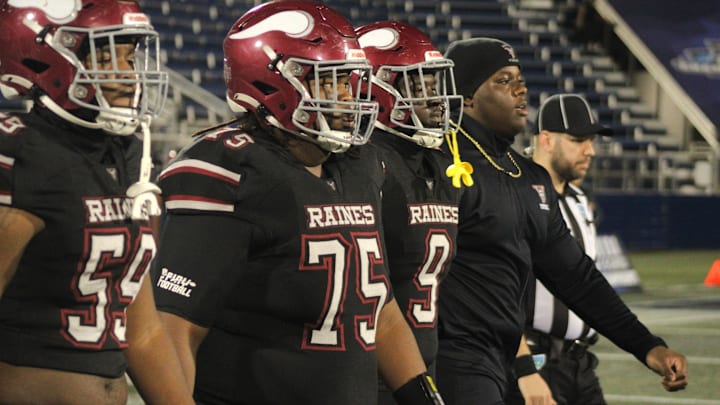 Raines team captains Antonio Allen (59), Syon Hawkins (75), Jyon Simon (9) and Solomon Thomas walk to midfield for the coin toss against Miami Northwestern in the FHSAA Class 3A high school football championship on Dec. 14, 2024. [Clayton Freeman/Florida Times-Union]