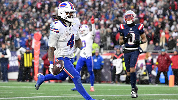 Dec 14, 2025; Foxborough, Massachusetts, USA; Buffalo Bills running back James Cook III (4) runs for a touchdown against the New England Patriots