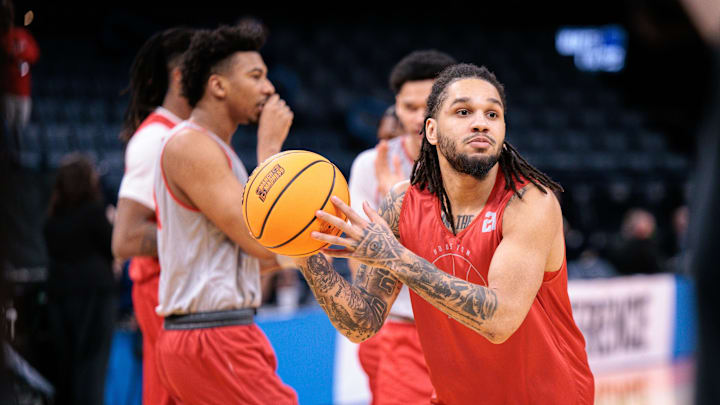 Mar 18, 2026; Oklahoma City, OK, USA; Houston Cougars guard Emanuel Sharp (21) drives to the basket during a practice session ahead of the first round of the men's 2026 NCAA Tournament at Paycom Center. Mandatory Credit: William Purnell-Imagn Images