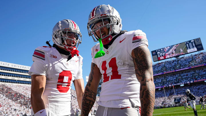 Ohio State Buckeyes wide receiver Brandon Inniss (11) celebrates a touchdown catch with wide receiver Jayden Ballard (9) during the first half of the NCAA football game against the Penn State Nittany Lions at Beaver Stadium in University Park, Pa. on Saturday, Nov. 2, 2024.