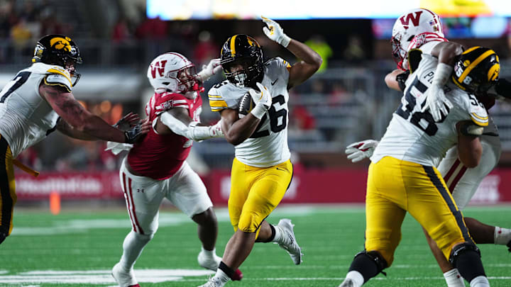 Oct 11, 2025; Madison, Wisconsin, USA; Iowa Hawkeyes running back Xavier Williams (26) runs the ball during the second half against the Wisconsin Badgers at Camp Randall Stadium. Mandatory Credit: Ross Harried-Imagn Images