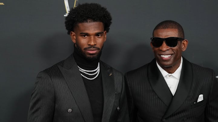 Feb 6, 2025; New Orleans, LA, USA;  Deion Sanders (right) with his son Shedeur Sanders on the red carpet before Super Bowl LIX NFL Honors at Saenger Theatre. Mandatory Credit: Kirby Lee-Imagn Images