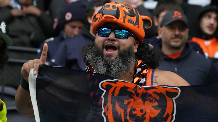 A Chicago Bears fan holds a flag in the second half during an NFL International Series game against the Jacksonville Jaguars at Tottenham Hotspur Stadium.