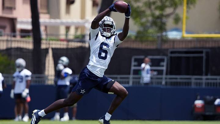 Dallas Cowboys receiver Camden Brown catches the ball at training camp at River Ridge Playing Fields. Dallas Cowboys receiver Camden Brown catches the ball at training camp at River Ridge Playing Fields.