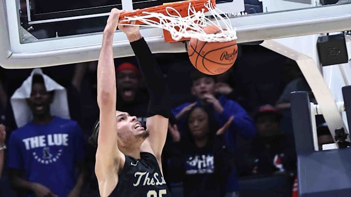 Lutheran East's Jesse McCulloch (35) dunks the ball during his team's win over Harvest Prep in the Division III state championship game Sunday, March 24, 2024.