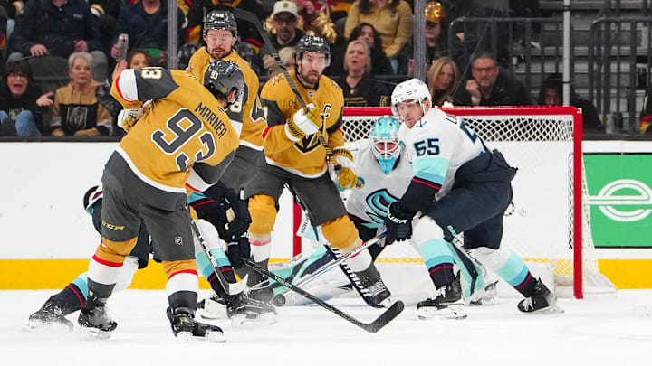 Jan 31, 2026; Las Vegas, Nevada, USA; Vegas Golden Knights right wing Mitch Marner (93) scores on a shot as center Tomas Hertl (48) and right wing Mark Stone (61) screen Seattle Kraken goaltender Joey Daccord (35) during the second period at T-Mobile Arena. Mandatory Credit: Stephen R. Sylvanie-Imagn Images